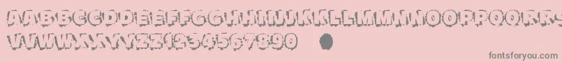 Scratchtoreveal-fontti – harmaat kirjasimet vaaleanpunaisella taustalla