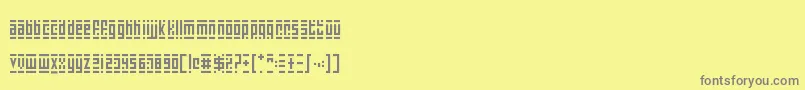 SuperSkinnyPixelBricks Font – Gray Fonts on Yellow Background