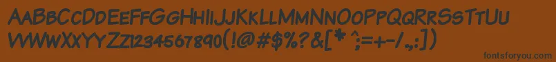 フォントKomtxtkb – 黒い文字が茶色の背景にあります