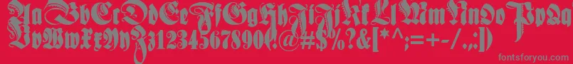 Fonte Schmaleanzeigenschriftzier – fontes cinzas em um fundo vermelho