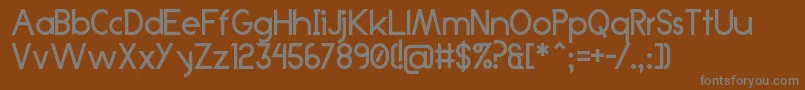 フォントAnklada99 – 茶色の背景に灰色の文字
