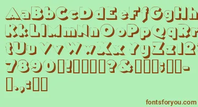 Tricorneoutlinessk font – Brown Fonts On Green Background