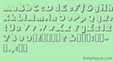 Tricorneoutlinessk font – Gray Fonts On Green Background