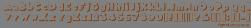 フォントTricorneoutlinessk – 茶色の文字が灰色の背景にあります。