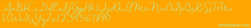 Nellasuedemo-Schriftart – Grüne Schriften auf orangefarbenem Hintergrund