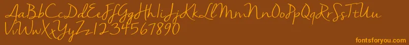 Nellasuedemo Font – Orange Fonts on Brown Background