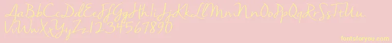 Nellasuedemo-Schriftart – Gelbe Schriften auf rosa Hintergrund