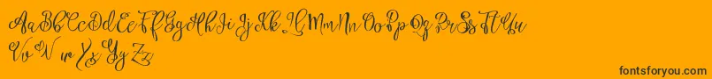 Esztydemo-Schriftart – Schwarze Schriften auf orangefarbenem Hintergrund