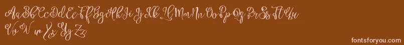 Fonte Esztydemo – fontes rosa em um fundo marrom