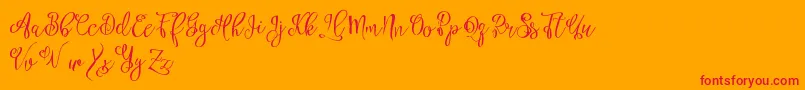 Esztydemo-Schriftart – Rote Schriften auf orangefarbenem Hintergrund