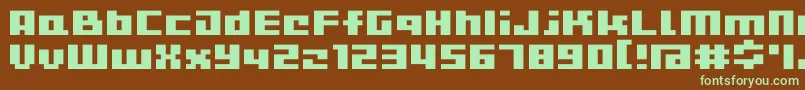 フォントD3CutebitmapismTypea – 緑色の文字が茶色の背景にあります。