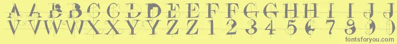 フォントDrunkenconstructor – 黄色の背景に灰色の文字