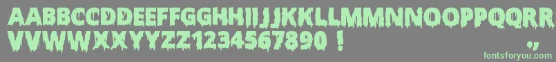 Fonte ScaryHalloweenFont – fontes verdes em um fundo cinza