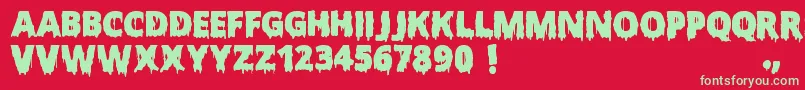 Czcionka ScaryHalloweenFont – zielone czcionki na czerwonym tle