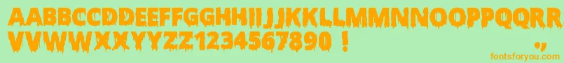 フォントScaryHalloweenFont – オレンジの文字が緑の背景にあります。