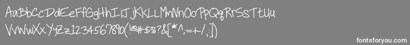 フォントKbneiledit – 灰色の背景に白い文字