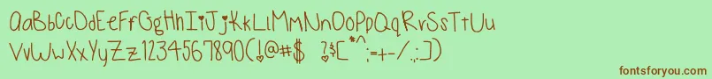 Czcionka MonkeysAndBananas – brązowe czcionki na zielonym tle