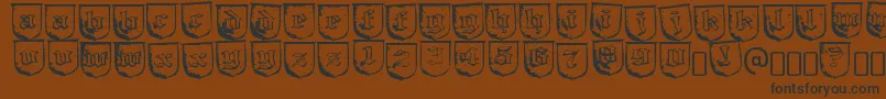 フォントTrollbaitRegular – 黒い文字が茶色の背景にあります