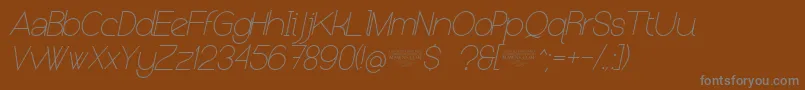 Saiba mais sobre a fonte NolicenseKeraterultralightitalic Fonte NolicenseKeraterultralightitalic – fontes cinzas em um fundo marrom