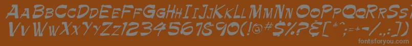 PamelaRegular-fontti – harmaat kirjasimet ruskealla taustalla