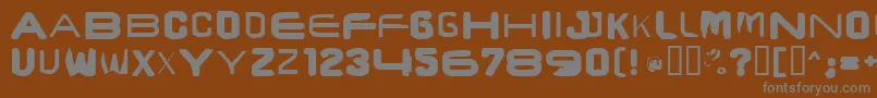 フォントBrunstcaps – 茶色の背景に灰色の文字