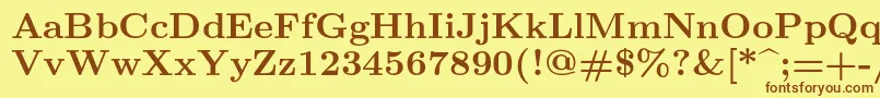 Fonte Lmroman9Bold – fontes marrons em um fundo amarelo