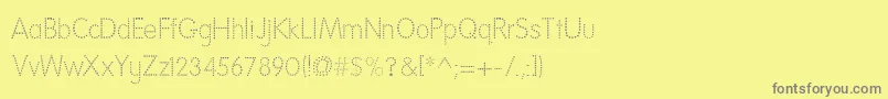 Fonte NationalFirstFontDotted – fontes cinzas em um fundo amarelo