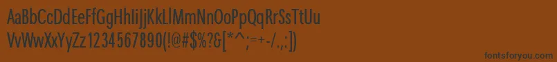 フォントMaximacyrtcyligcom – 黒い文字が茶色の背景にあります