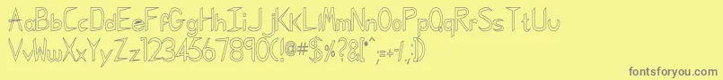 フォントGregorianKk – 黄色の背景に灰色の文字