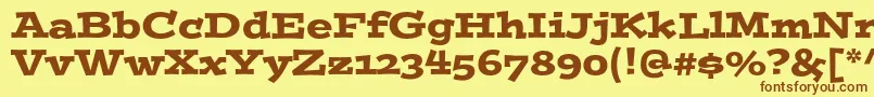 フォントPostinostd – 茶色の文字が黄色の背景にあります。