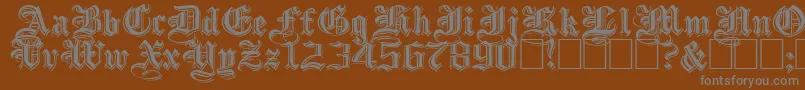EmbossedblackwideNormal-Schriftart – Graue Schriften auf braunem Hintergrund
