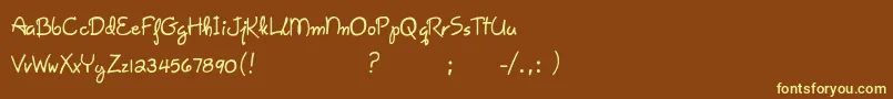 GiseleScript-fontti – keltaiset fontit ruskealla taustalla