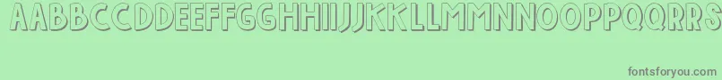 IndahPapuaku Font – Gray Fonts on Green Background