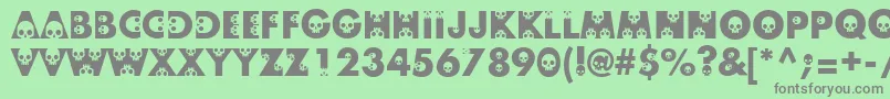 Skullphabetone Font – Gray Fonts on Green Background