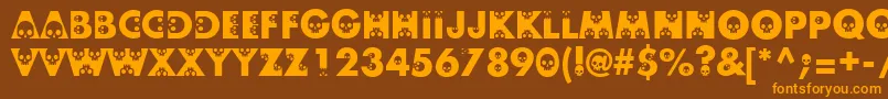 フォントSkullphabetone – オレンジ色の文字が茶色の背景にあります。