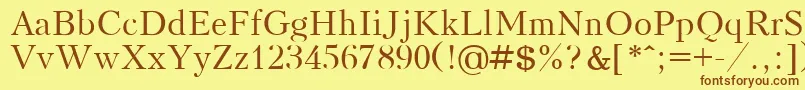 フォントKudrashovPlain – 茶色の文字が黄色の背景にあります。