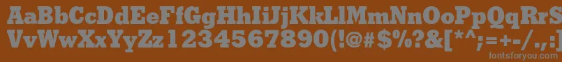 フォントShakulac – 茶色の背景に灰色の文字