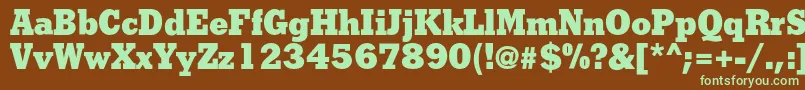フォントShakulac – 緑色の文字が茶色の背景にあります。