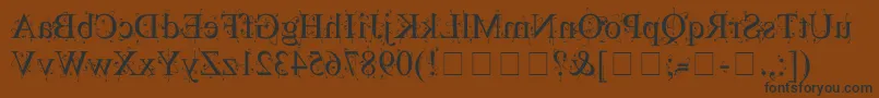 フォントKingthingsBackwards – 黒い文字が茶色の背景にあります