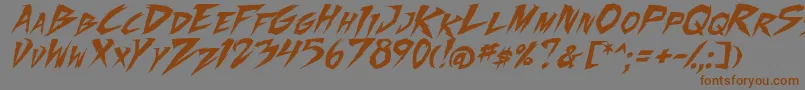 フォントFightingSpirit2Ital – 茶色の文字が灰色の背景にあります。
