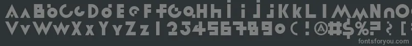 LinotypereneedisplayTypes-fontti – harmaat kirjasimet mustalla taustalla