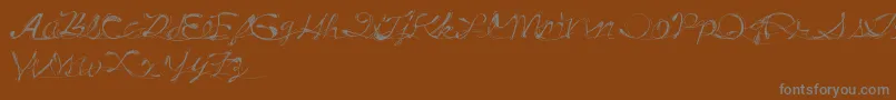 DrunkTattoo-Schriftart – Graue Schriften auf braunem Hintergrund