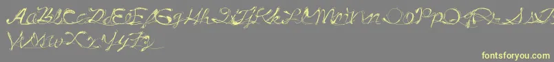 DrunkTattoo-Schriftart – Gelbe Schriften auf grauem Hintergrund