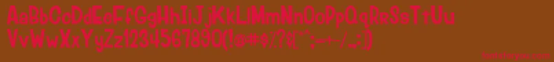 フォントLumberjackRegular – 赤い文字が茶色の背景にあります。