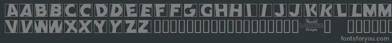 CometPositive-fontti – harmaat kirjasimet mustalla taustalla