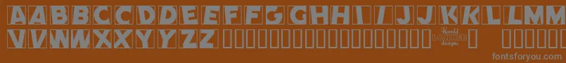 CometPositive-fontti – harmaat kirjasimet ruskealla taustalla