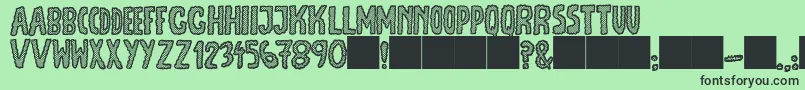 JmhEscamasWhite-Schriftart – Schwarze Schriften auf grünem Hintergrund