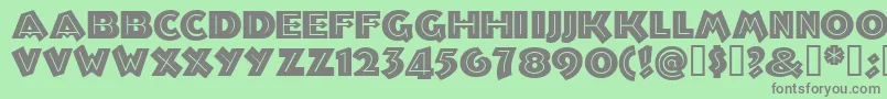 フォントTroglodytenf – 緑の背景に灰色の文字