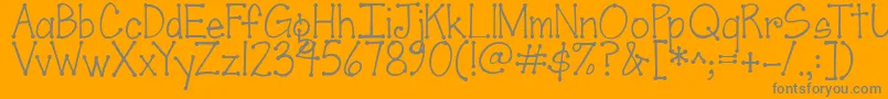 Czcionka Jandascrapgirldots – szare czcionki na pomarańczowym tle