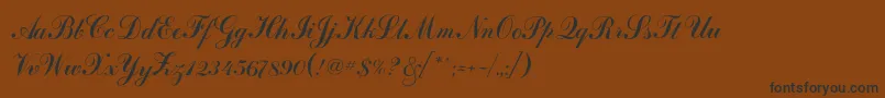 フォントArtscriptc – 黒い文字が茶色の背景にあります